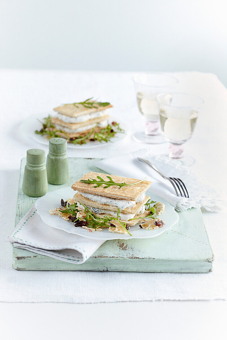Goat cheese millefeuille with sultana and cauliflower salad