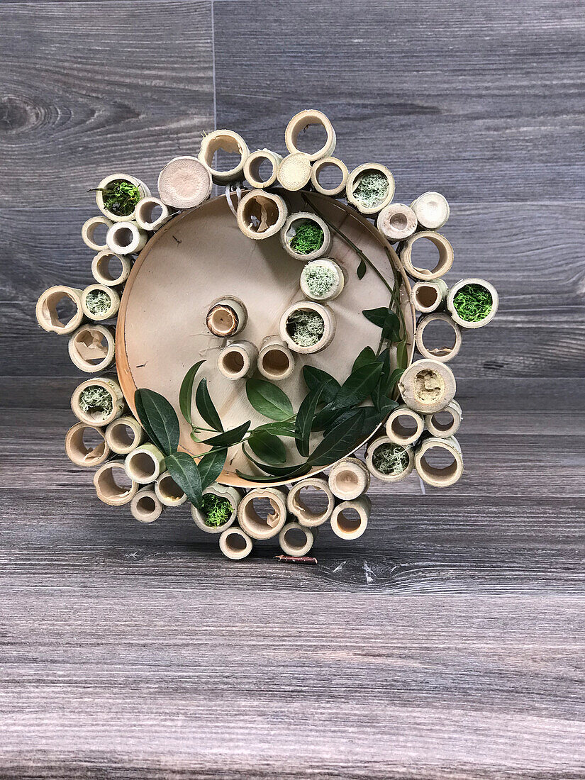 DIY wall decoration made of bamboo tubes with moss