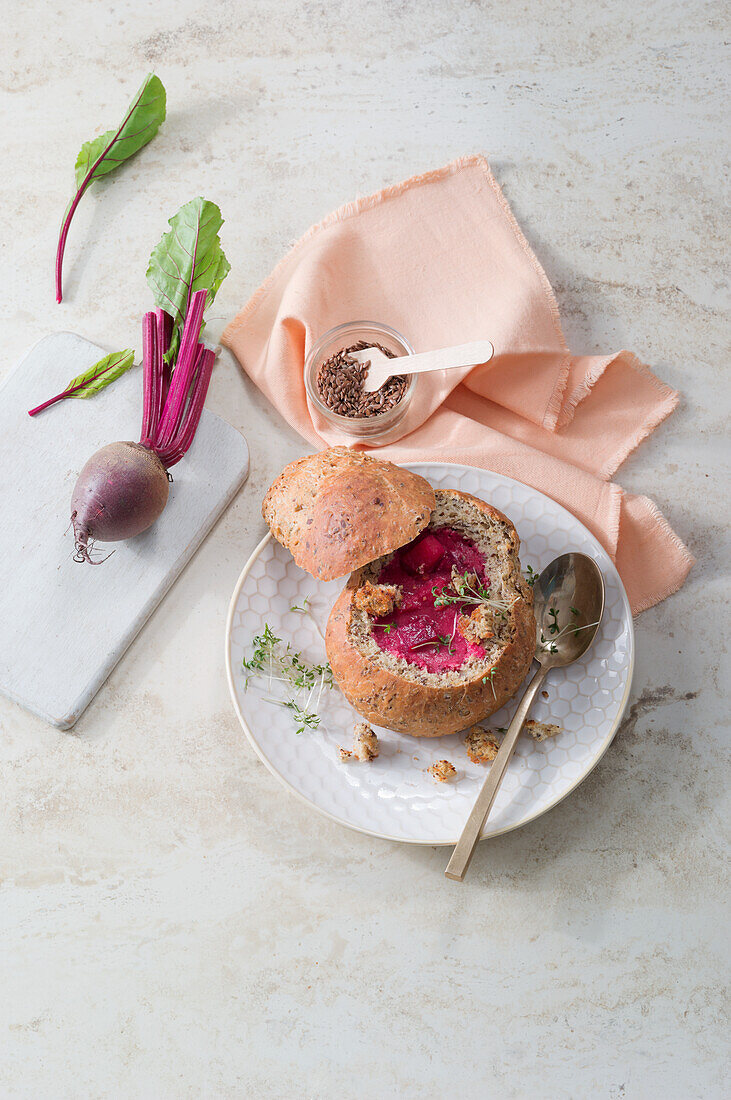 Beet soup served in a roll