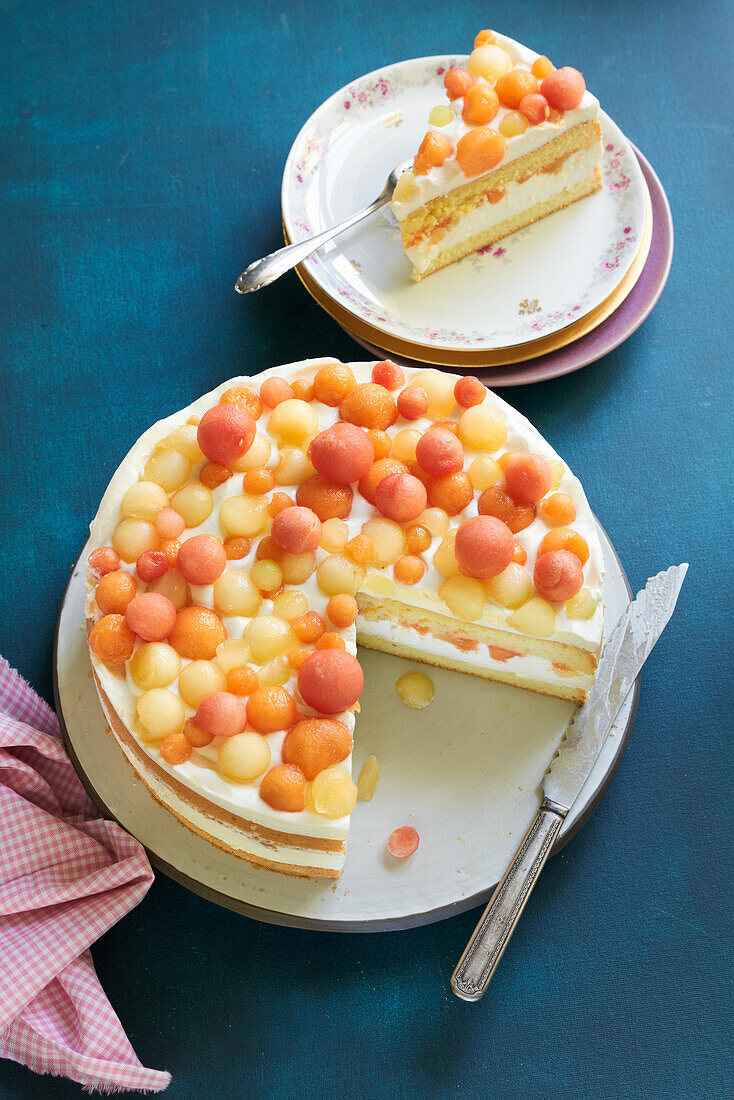 Cheese and cream cake with melon balls