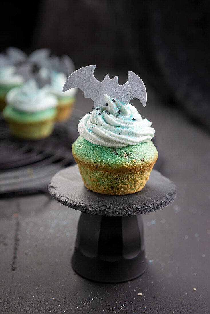 Vegan cupcakes with rice light chocolate cream and wafer decoration for Halloween
