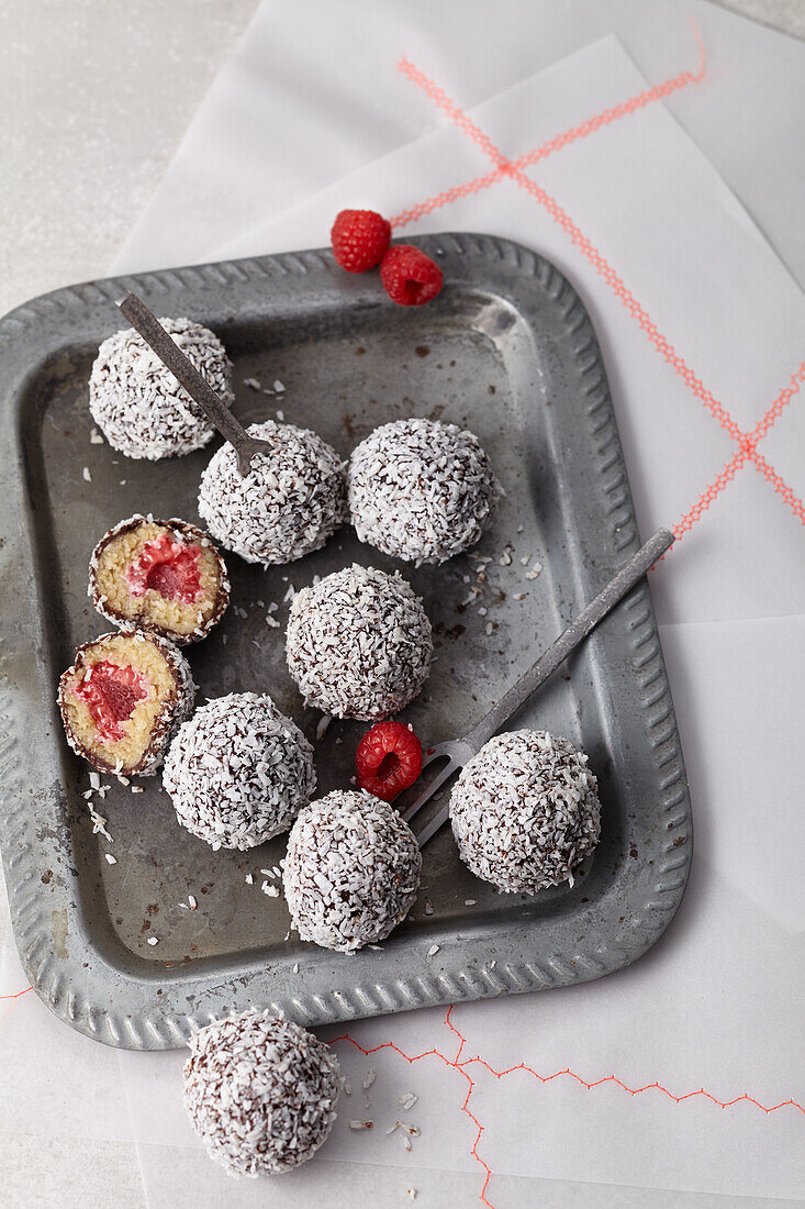 Raw Lamington Cake Balls with raspberries