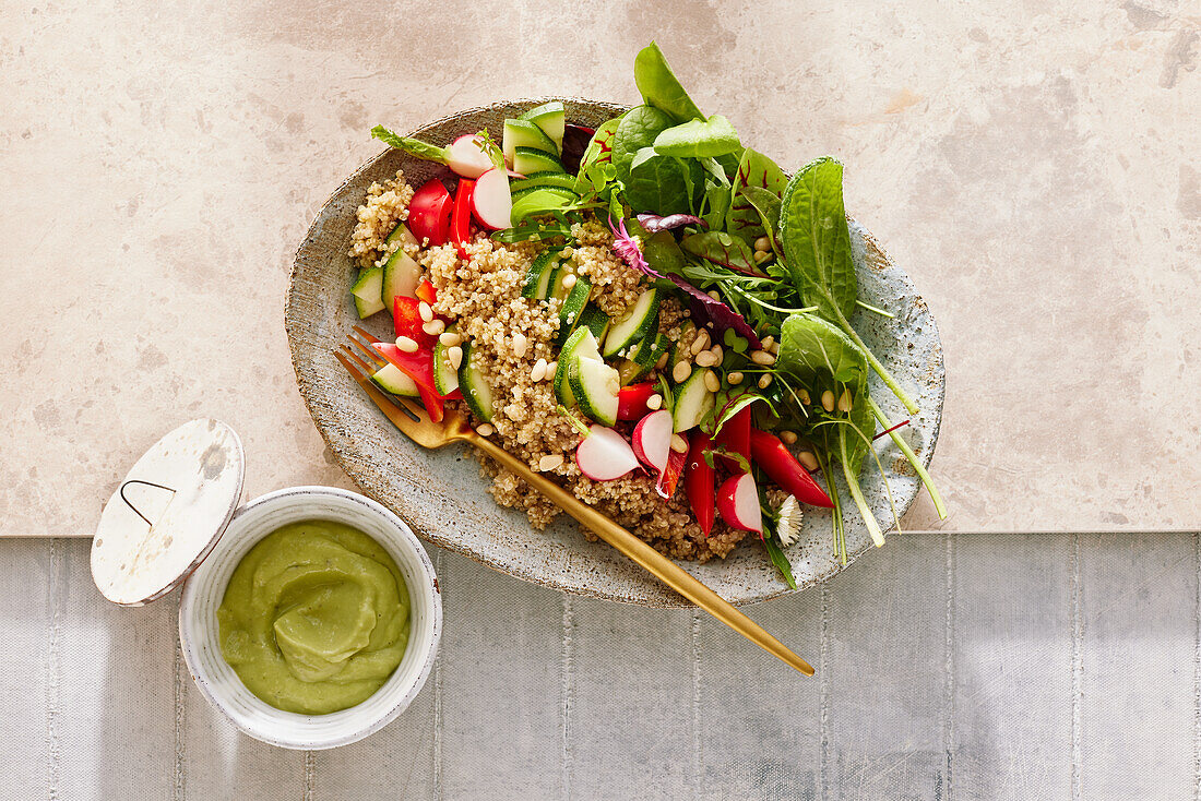 Quinoa with vegetables and avocado cream