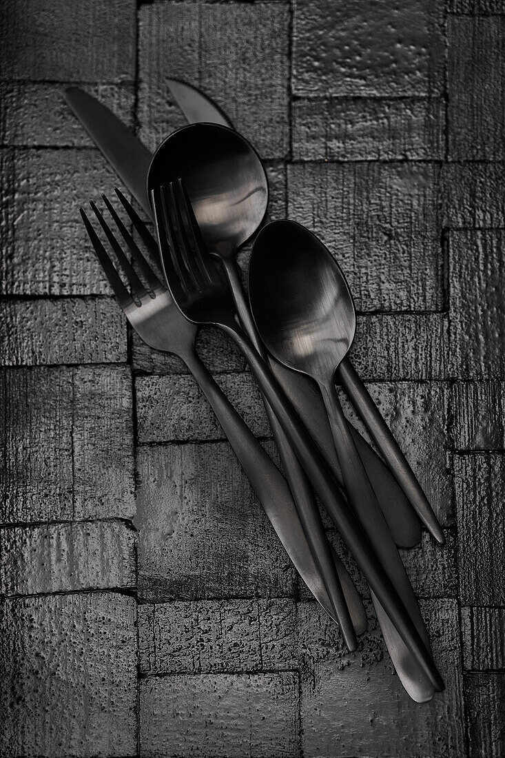 Black cutlery on a black background