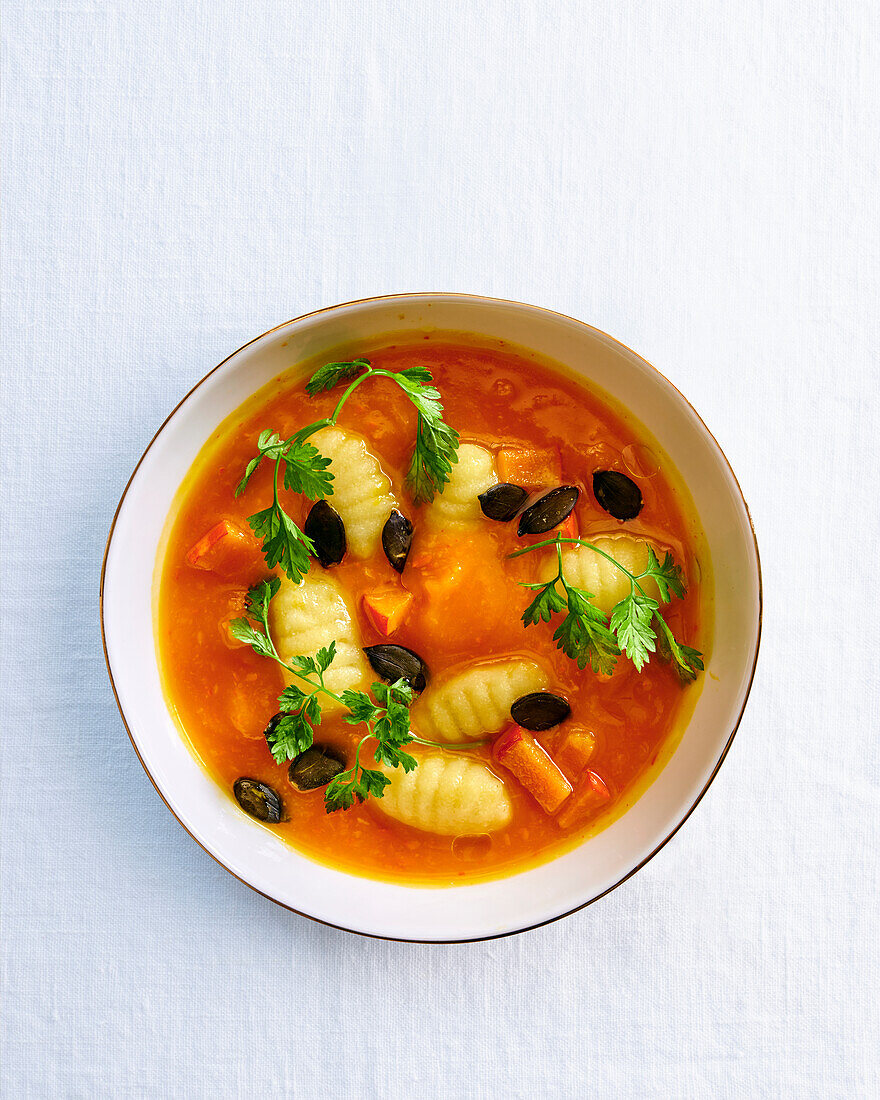 Pumpkin soup with gnocchi and pumpkin seeds