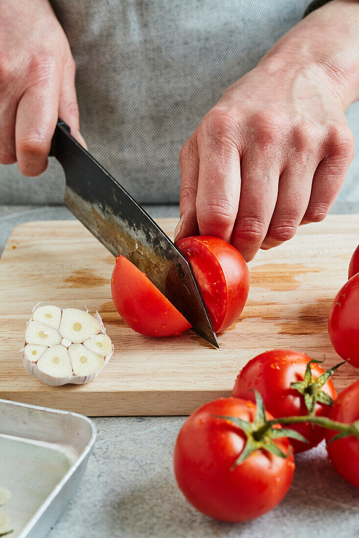 Preparing roasted tomato sauce - Chopping tomatoes