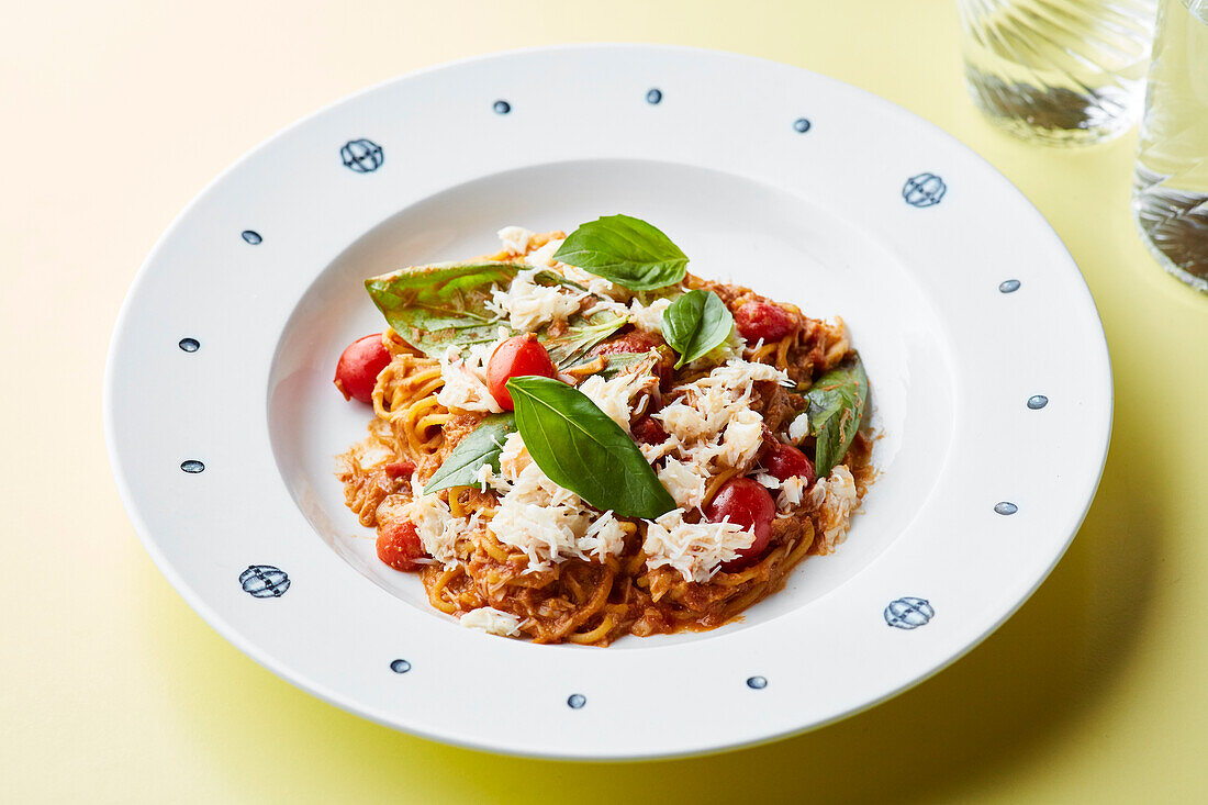 Spaghetti with tomato ragout, Parmesan and basil
