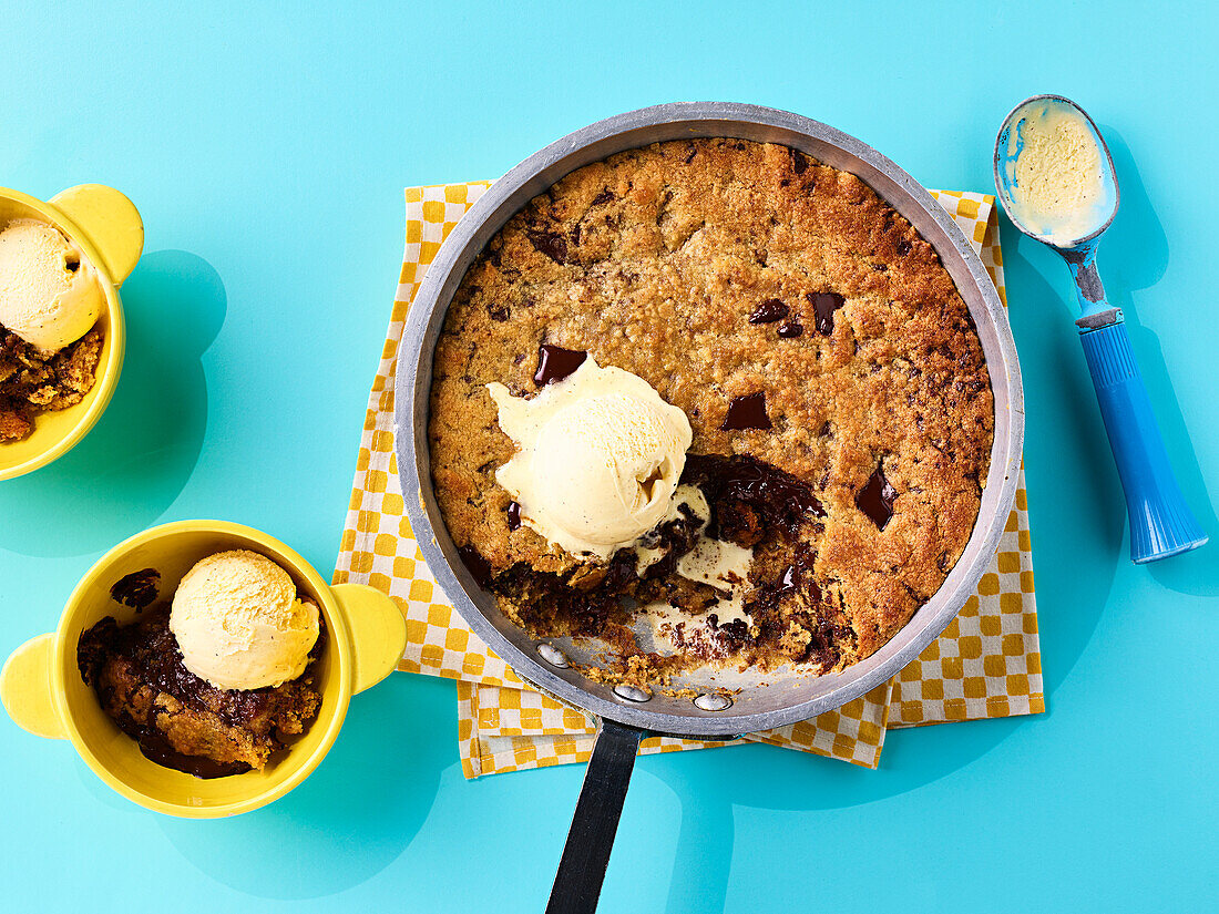 An XXL peanut butter chocolate cookie in a pan