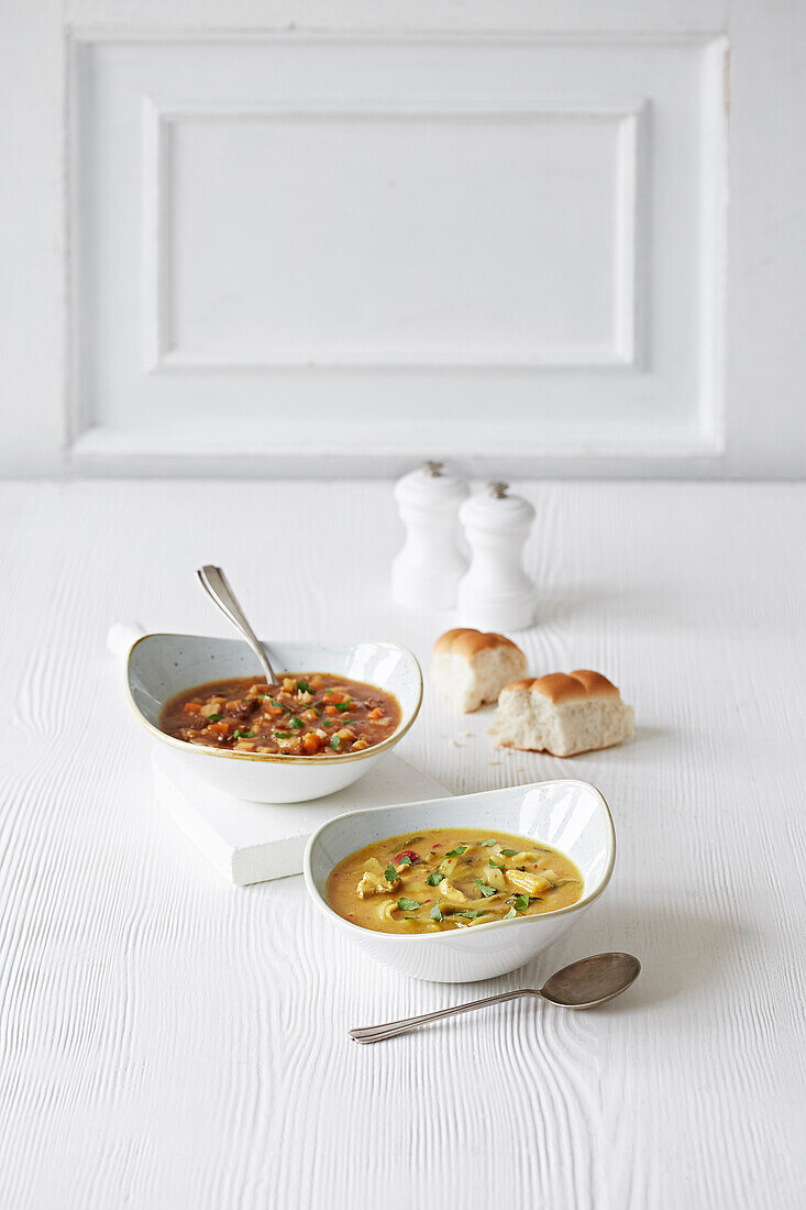 Vegetable soup and spicy Thai soup with bread