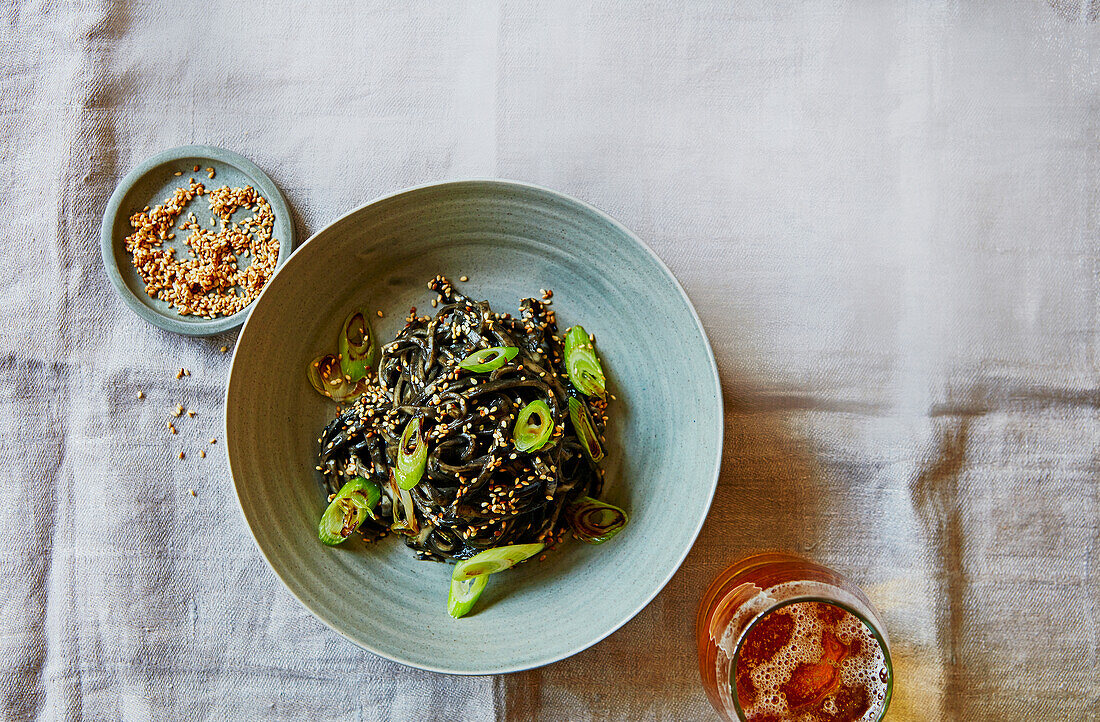 Black tahini noodles with crispy spring onions