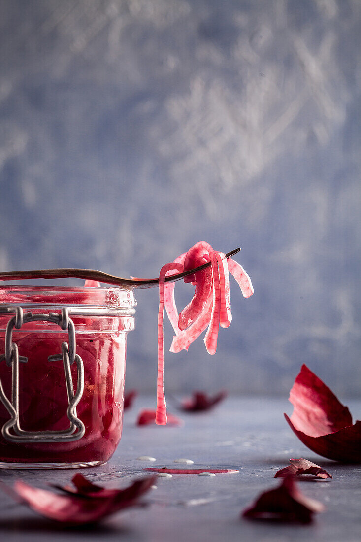 Pickled red onion in glass jar