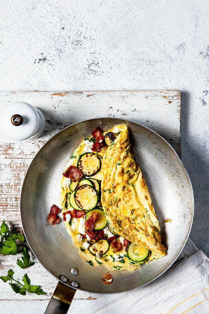 Flat leaf parsley omelette with feta, courgette and bacon