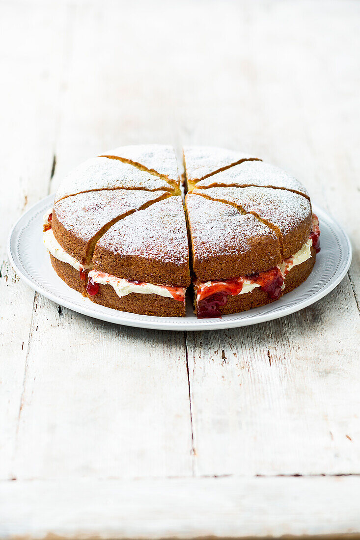 Victoria sponge cake with buttercream and strawberry jam