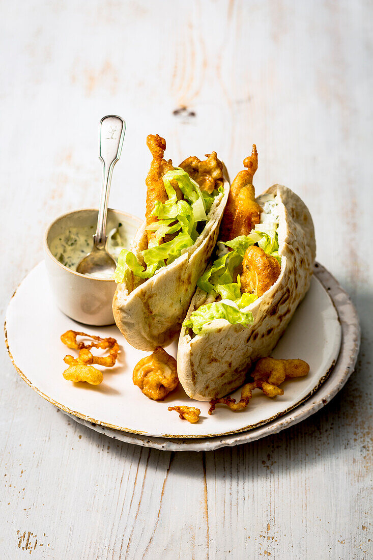 Fish goujons with tartare sauce, served in warm pitta bread