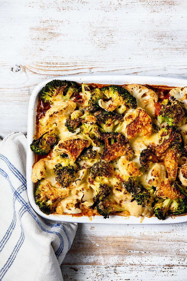 Cheesy cauliflower and broccoli topped vegetable and lentil pie