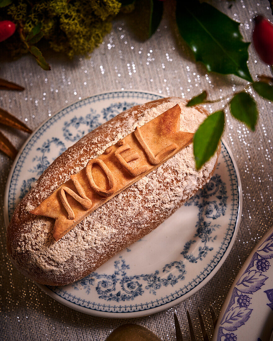 Sweet Christmas bread with 'Noel' written on it