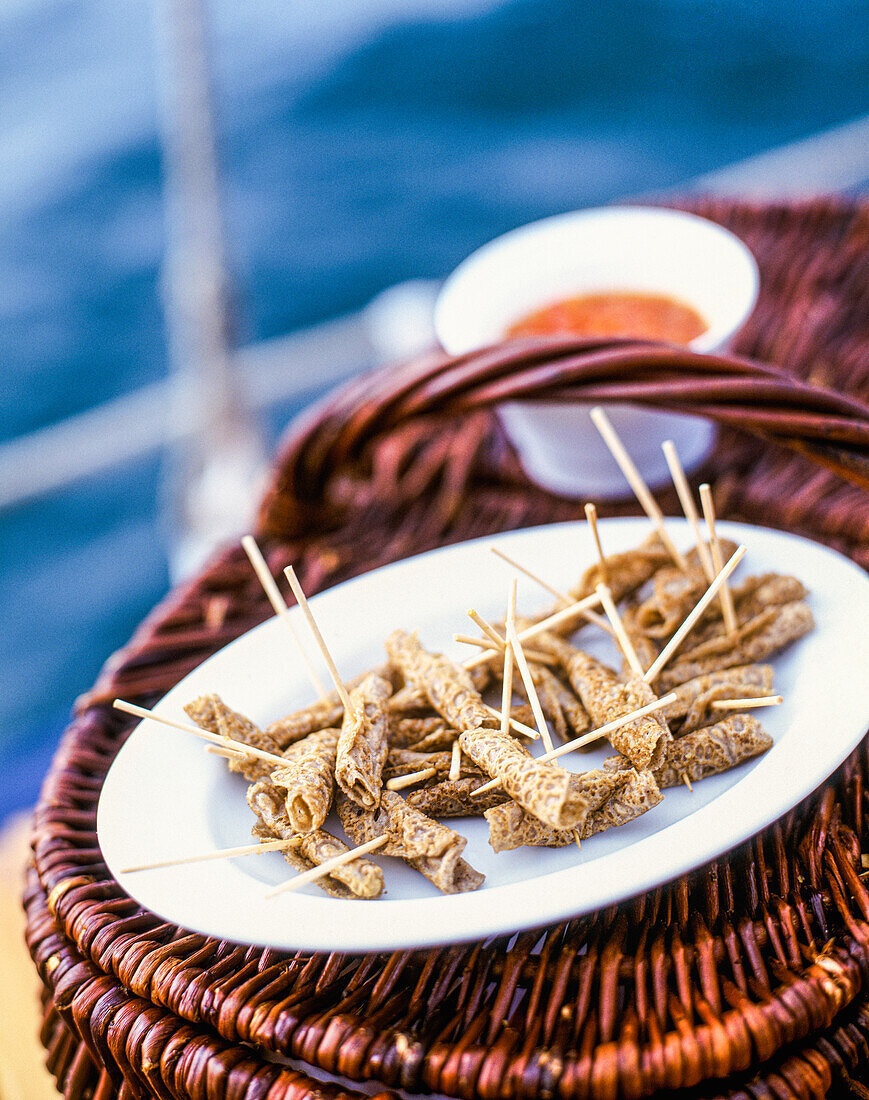 Pancake rolls on cocktail skewers