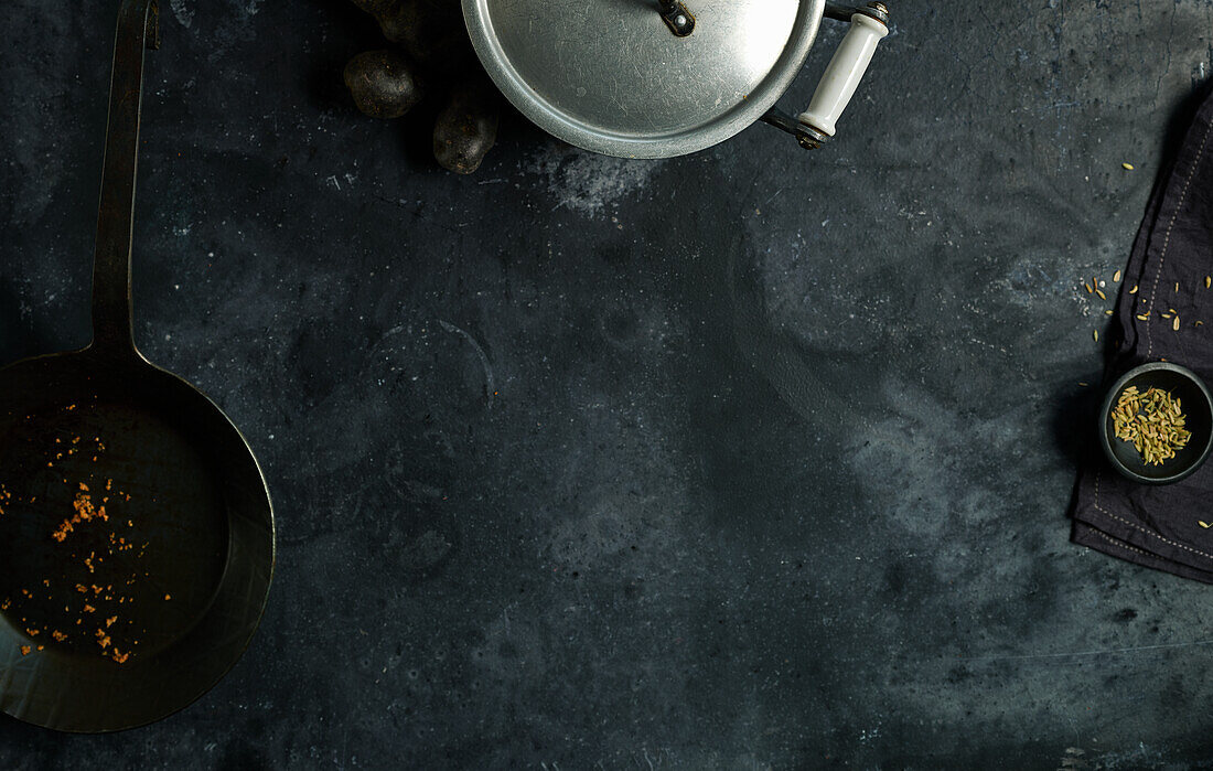 Silver stock pot and cast iron pan, and spices