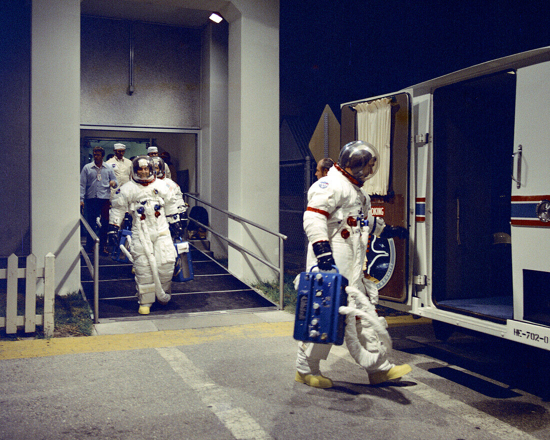 Apollo 17 astronauts boarding van to pre-launch tests