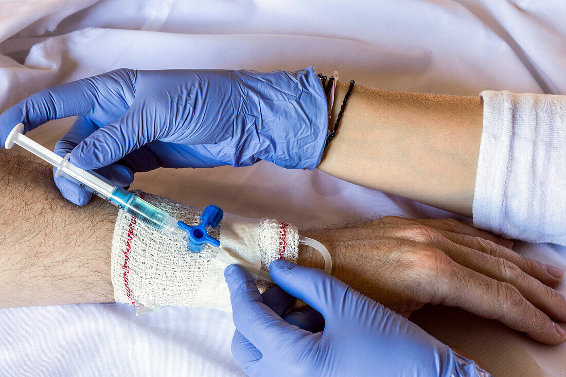 Nurse injecting man with antibiotics