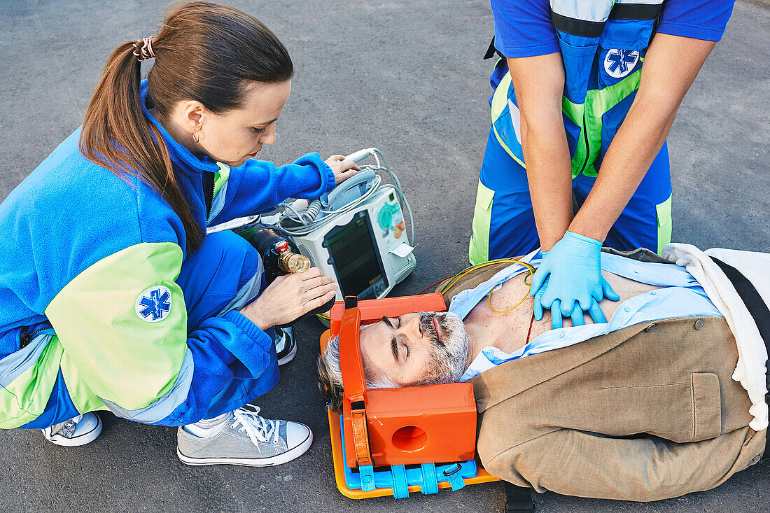 Paramedics treating patient