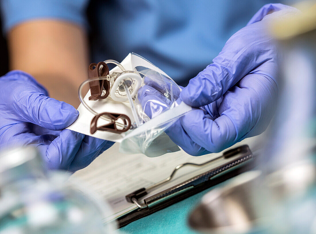 Nurse preparing venous catheters