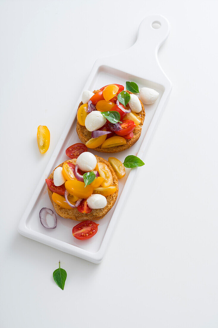 Friselle with cherry tomatoes and mini mozzarella