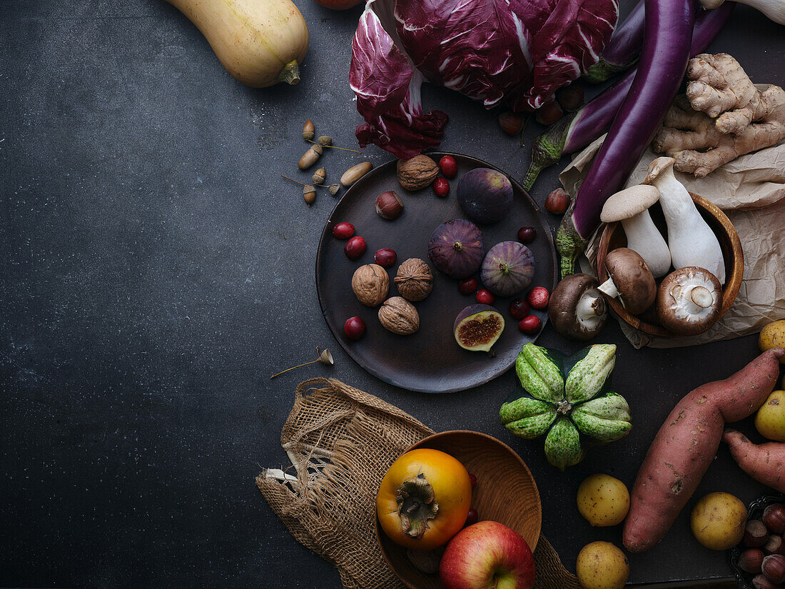 Seasonal groceries, healthy vegetarian ingredients on a dark background