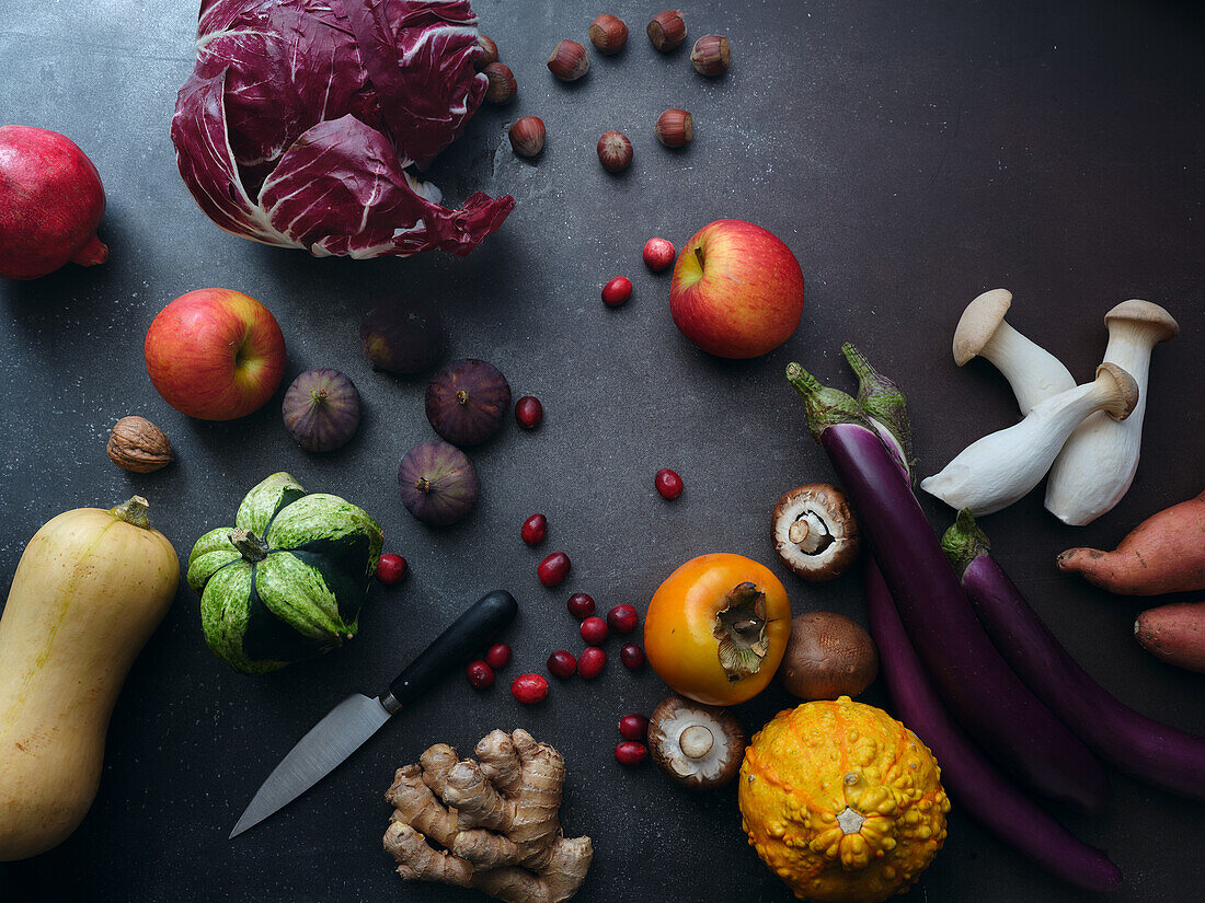 Top view seasonal groceries, healthy vegetarian ingredients on a dark background