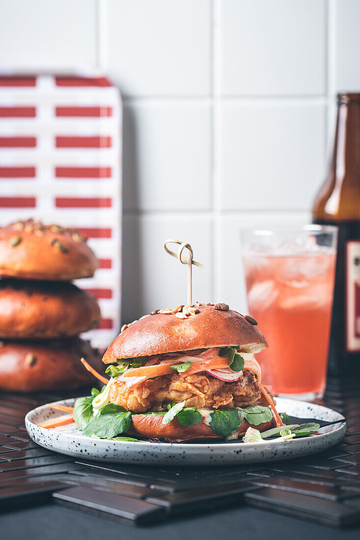 Burger with buttermilk chicken and zucchini slaw with honey mustard dressing