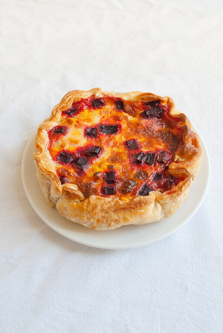 Mini quiche with goat cheese and beets