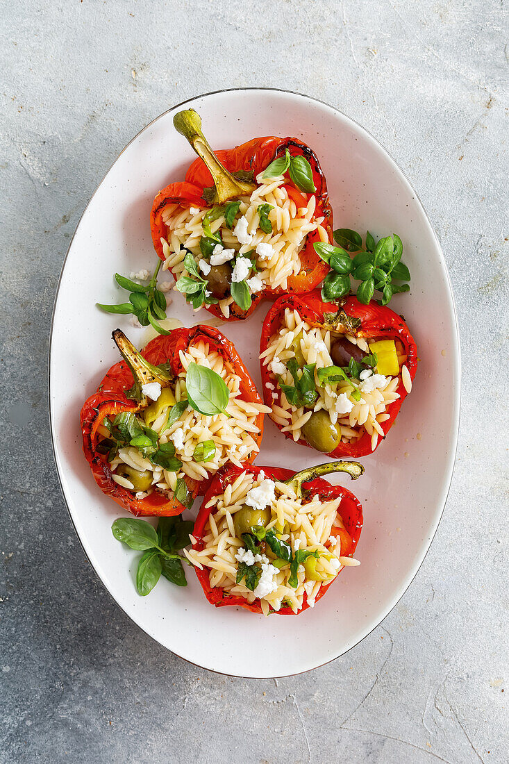 Stuffed pepper halves with orzo and olives