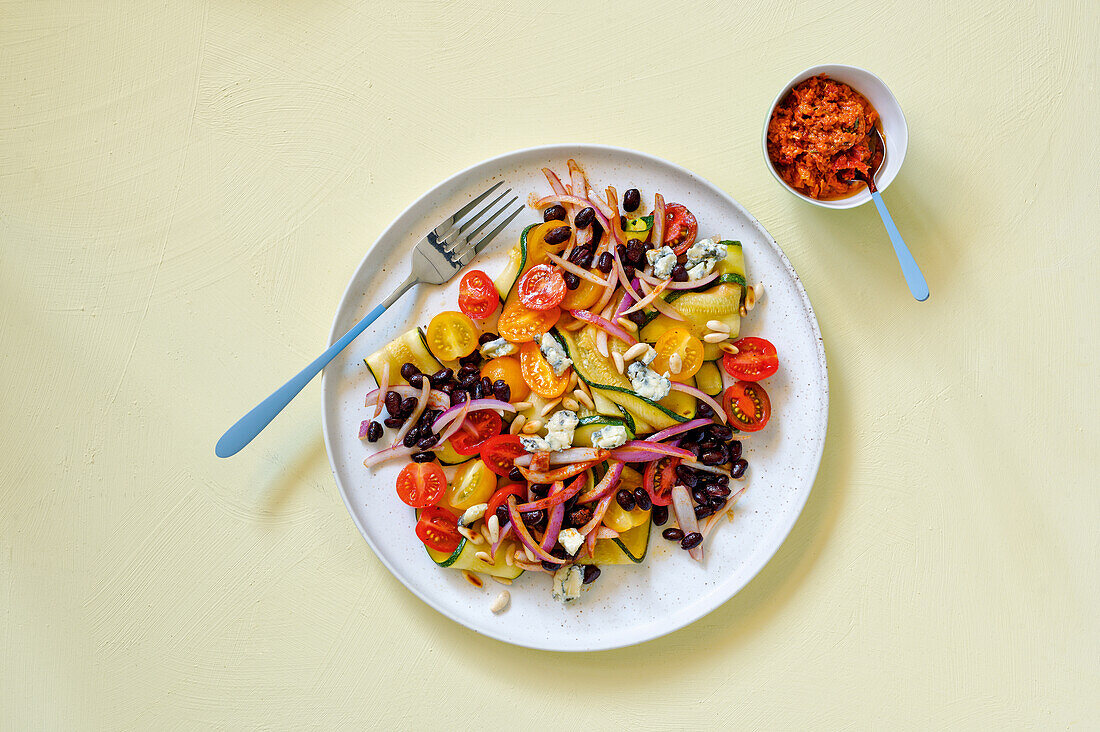 Fried Zucchini salad with tomatoes, beans, and pesto rosso