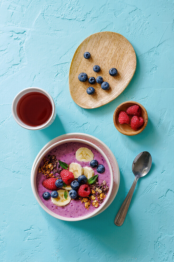 Smoothie bowl with cacao nibs, berries, and bananas