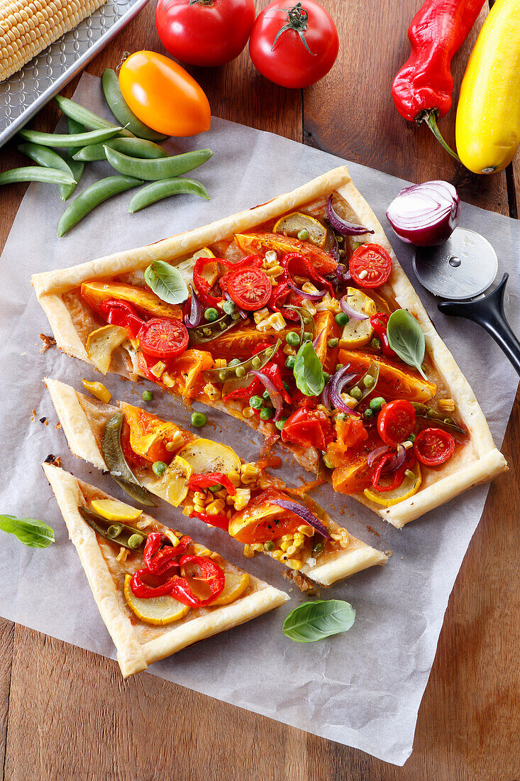 Baked puff pastry tart with various vegetables