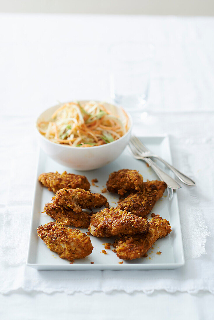 Crispy chicken pieces served with coleslaw