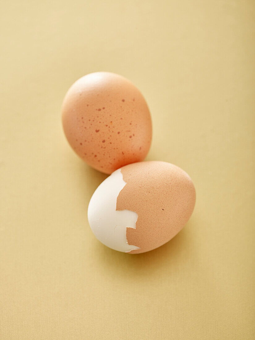 Two eggs, partially peeled