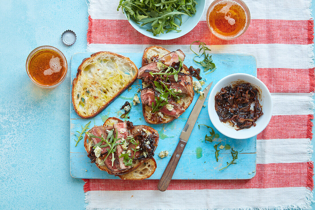Toast with steak, sticky onions, and blue cheese