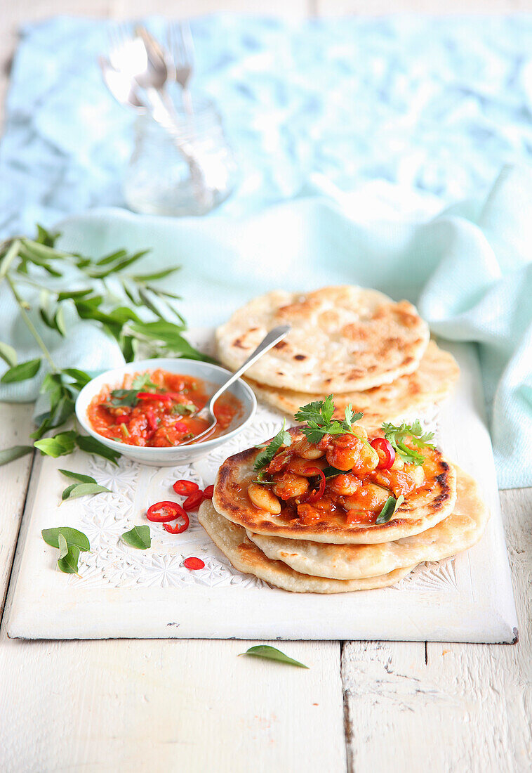 Roti with butter bean curry and tomato salsa