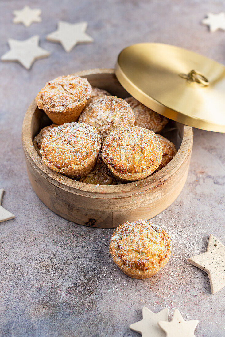 Mince pies with date-apple filling in cinnamon shortcrust pastry and almond frangipane topping