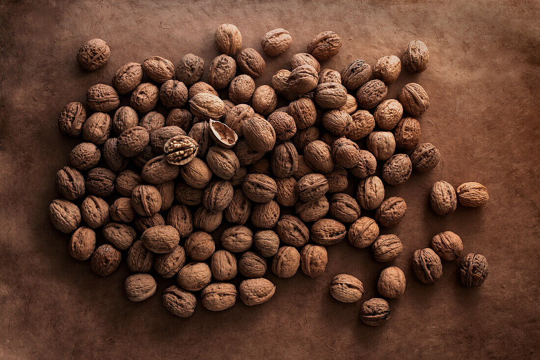 Walnuts on a brown background