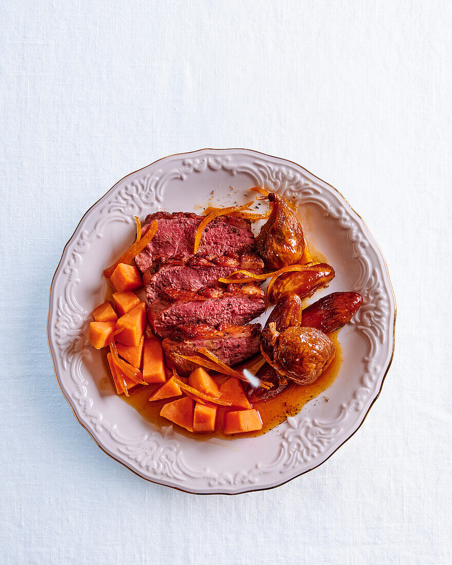 Duck breast with orange, dates, figs, and pumpkin
