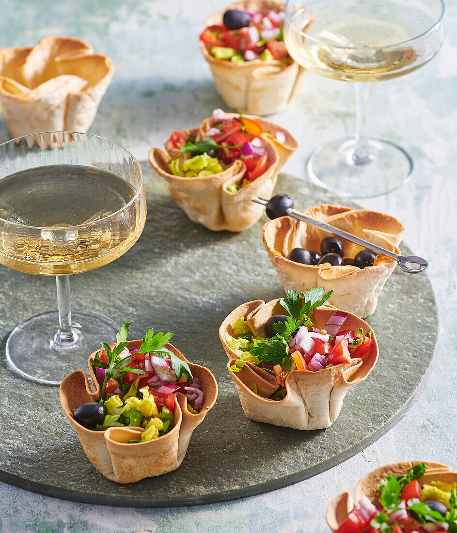 Edible filled tortilla bowls as finger food for a party