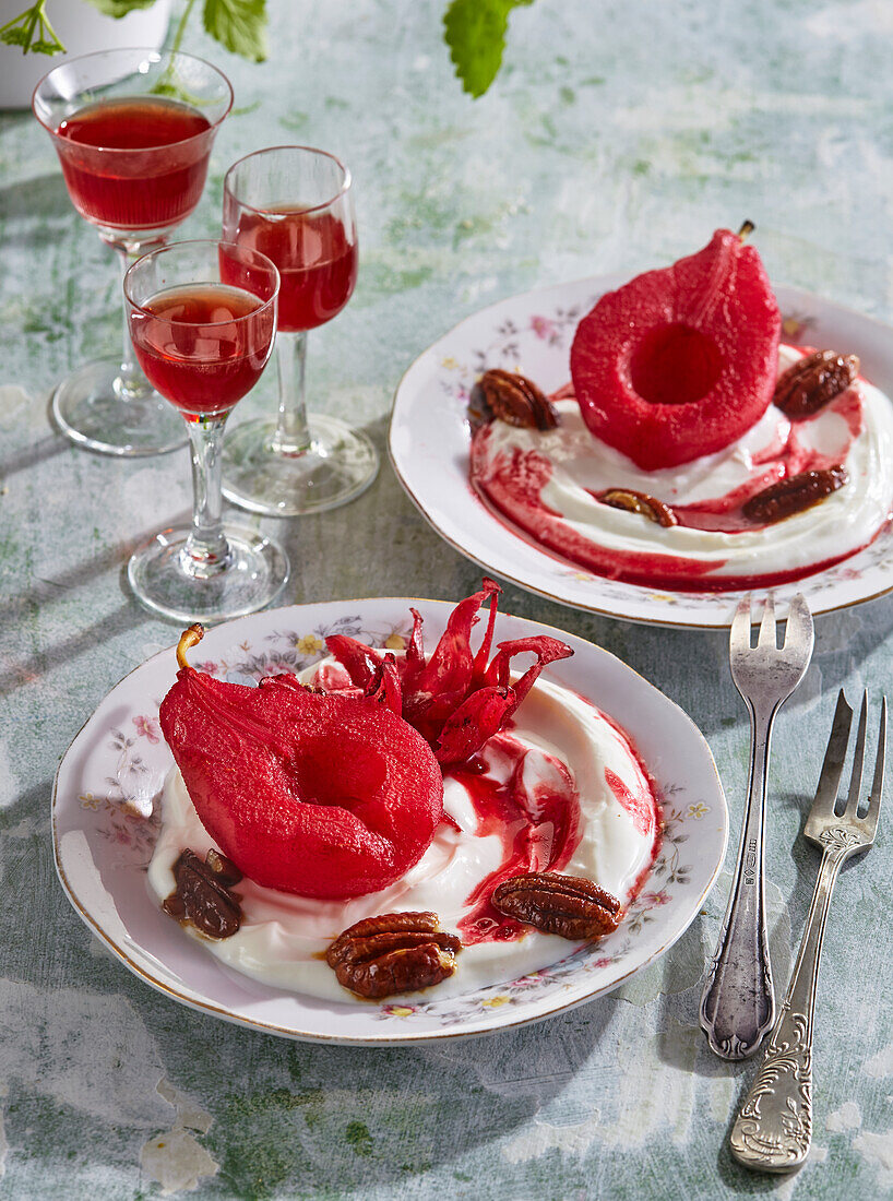 Poached pears with sour cream and honey pecans