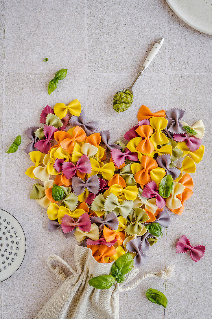 Colourful farfalle with pesto