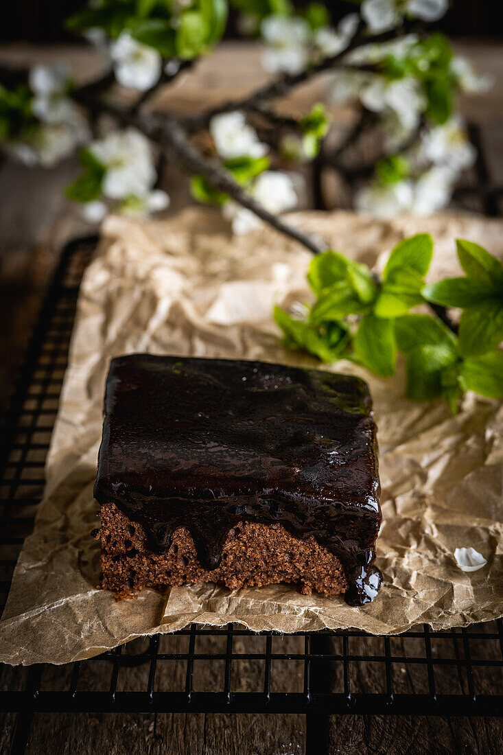 A piece of chocolate cake with chocolate icing