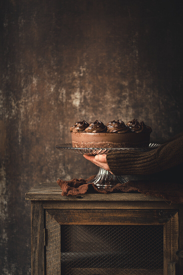Vegan chocolate cake against a brown background