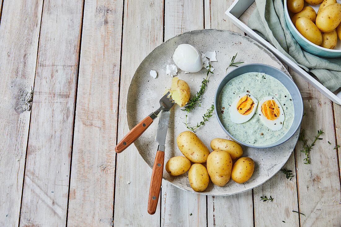 Small boiled potatoes and herb quark with boiled egg