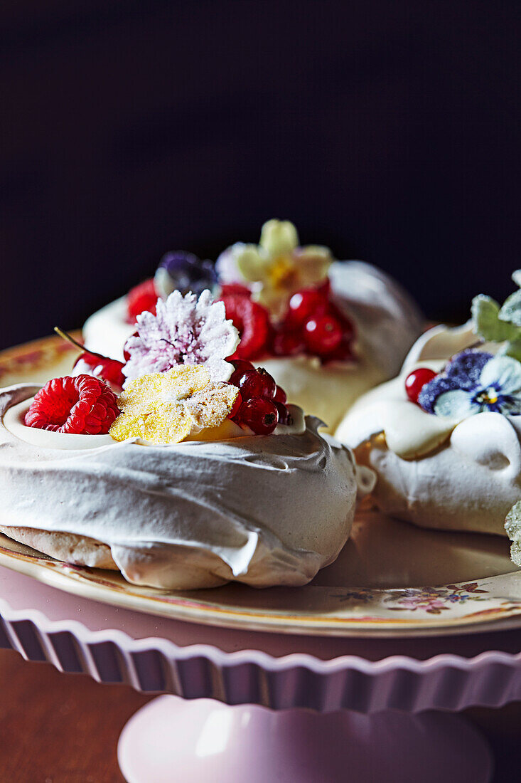Mini pavlovas with berries and candied flowers