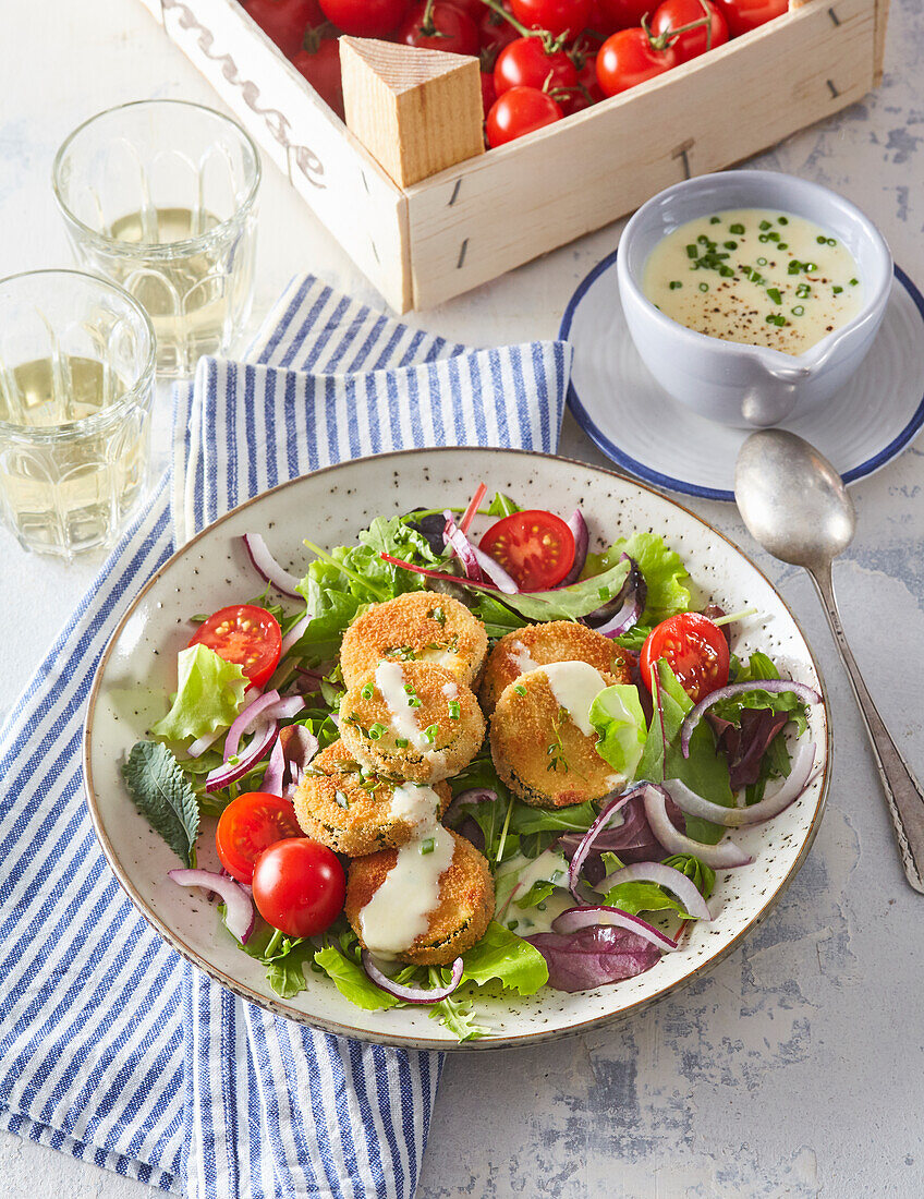 Salad with fried and breaded zucchini slices